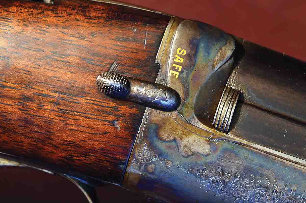 The original H&H design for its “Ross” model employed a hammer-block safety that was operated by a small lever on the side of the action. It is convenient and very effective.